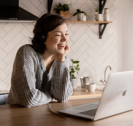 A woman in a video call smiling